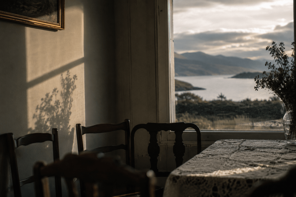 Dining room overlooking the Kerry landscape, evoking a family home prepared for the Stations.
