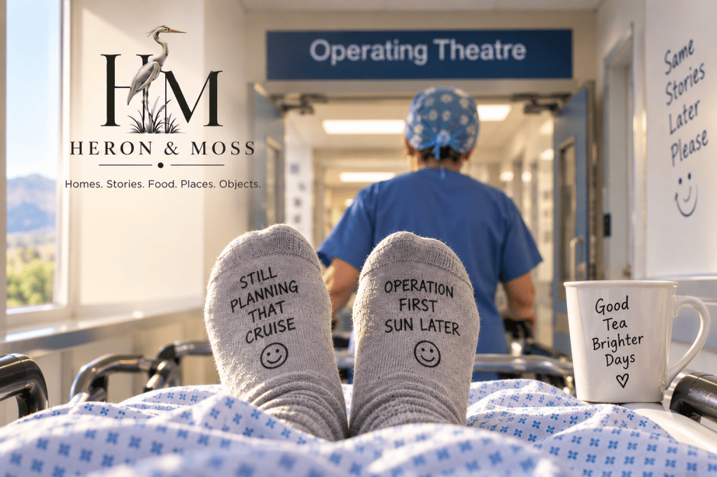 Patient’s view from a hospital trolley approaching an operating theatre, with a member of staff ahead and humorous messages on the patient’s socks.